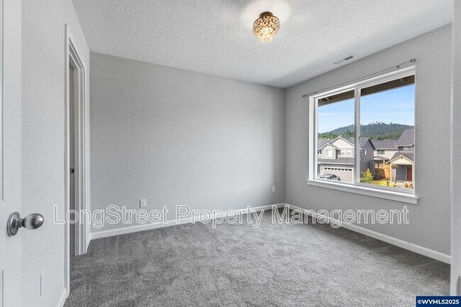 Building Photo - 7177 SE Sarah Dr