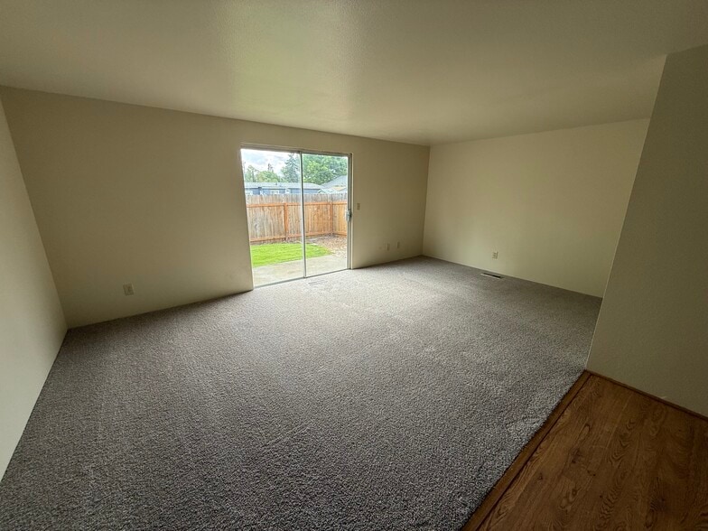 Living room, back yard sliding door - 329 Bessie St
