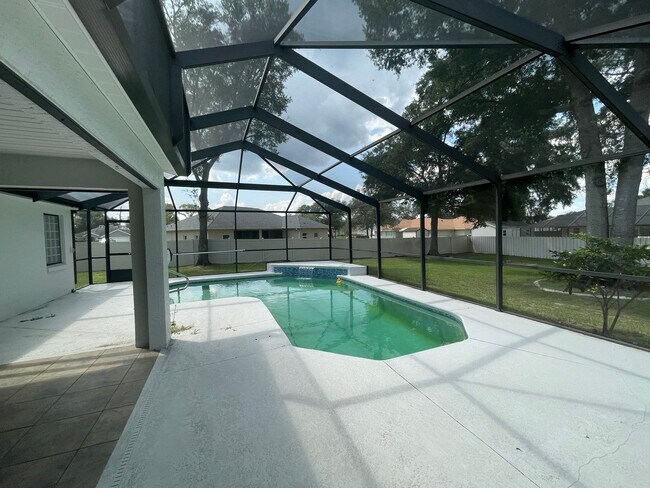 Building Photo - Spacious 4-Bedroom Pool Home – 2 Primary S...
