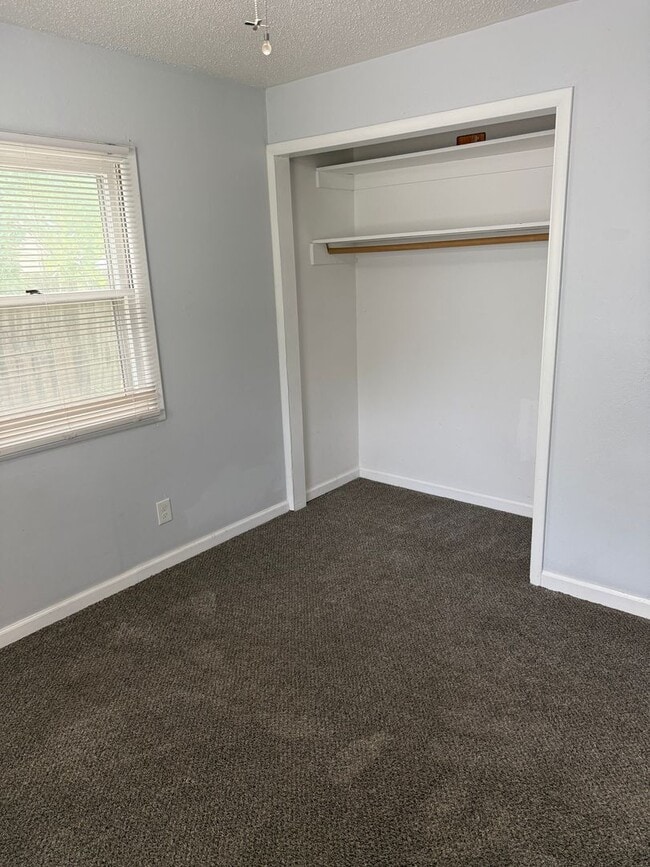 Building Photo - 3BR/1BA with overside detached garage read...