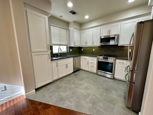 Building Photo - REMODELED TOWNHOME WITH THOUGHTFUL UPGRADE...