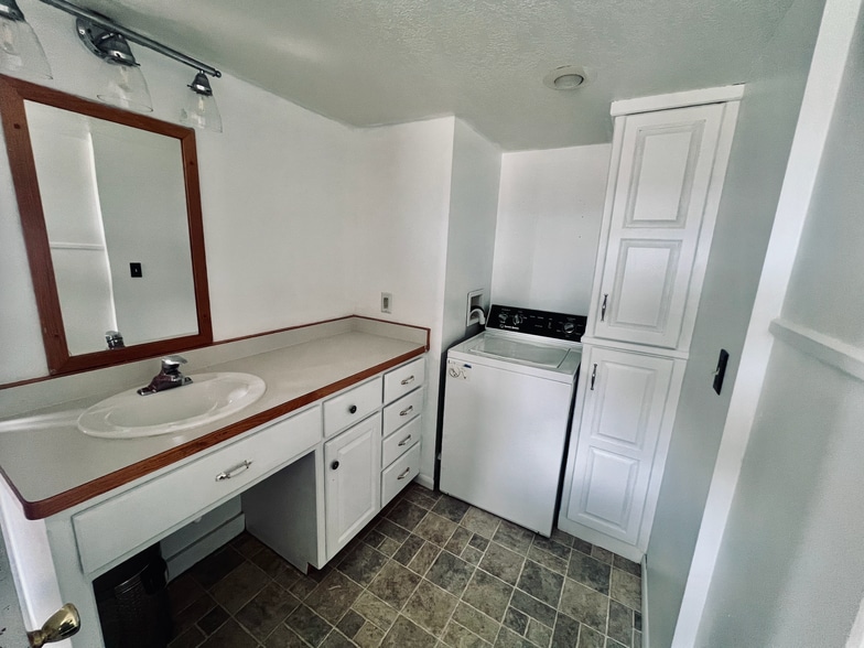 Bathroom, also with laundry amenities (washer and dryer). - 13433 County 13