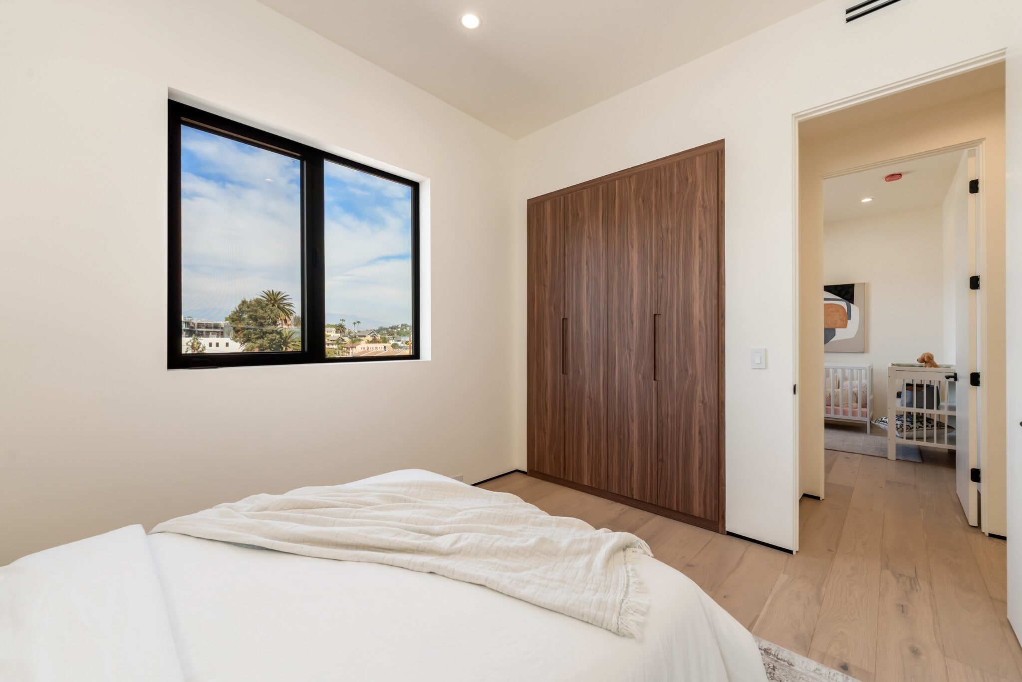 Each bedroom includes a closet with built-in shelves and drawers for organized storage - 836 Waterloo St