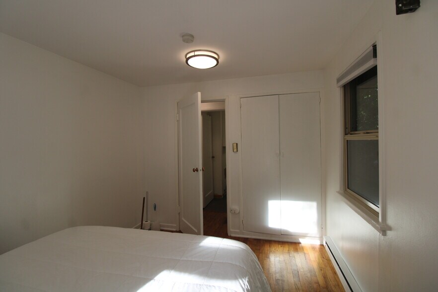 Bedroom showing closet - 9228 37th Ave SW