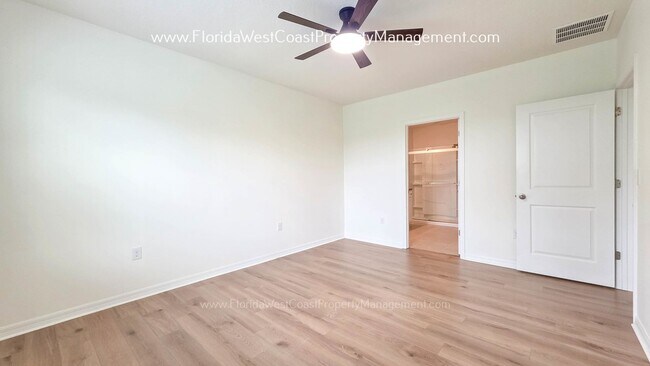 Building Photo - MOVE IN READY ! 4 BEDROOM/2 BATH! TILE- LVP THROUGHOUT! LAWN MOWING INCLUDED!