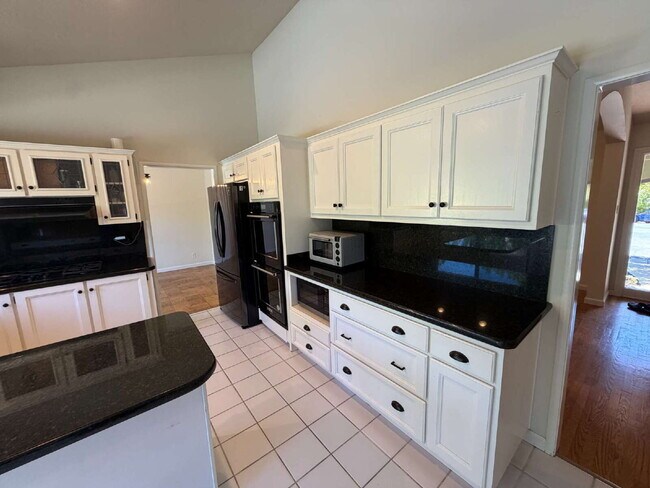 Building Photo - "Charming Walnut Creek Retreat: Spacious 4-Bedroom Home with Elegant Granite Kitchen, Cozy Firepl...
