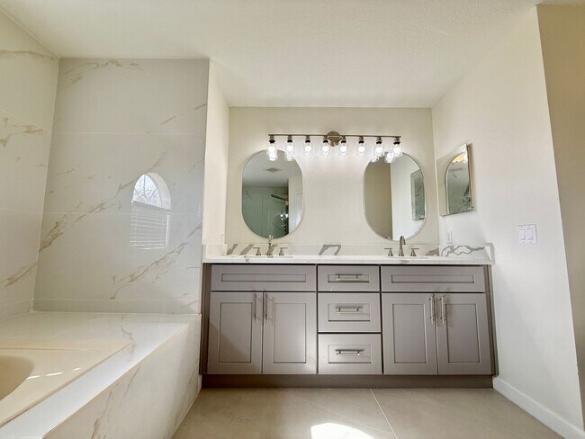 Building Photo - GORGEOUS, Large Completely Renovated Two-Story 4/2.5 PLUS LOFT in POINCIANA VILLAGES!