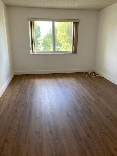 Bedroom New Wood Floors - 7920 Camino Real