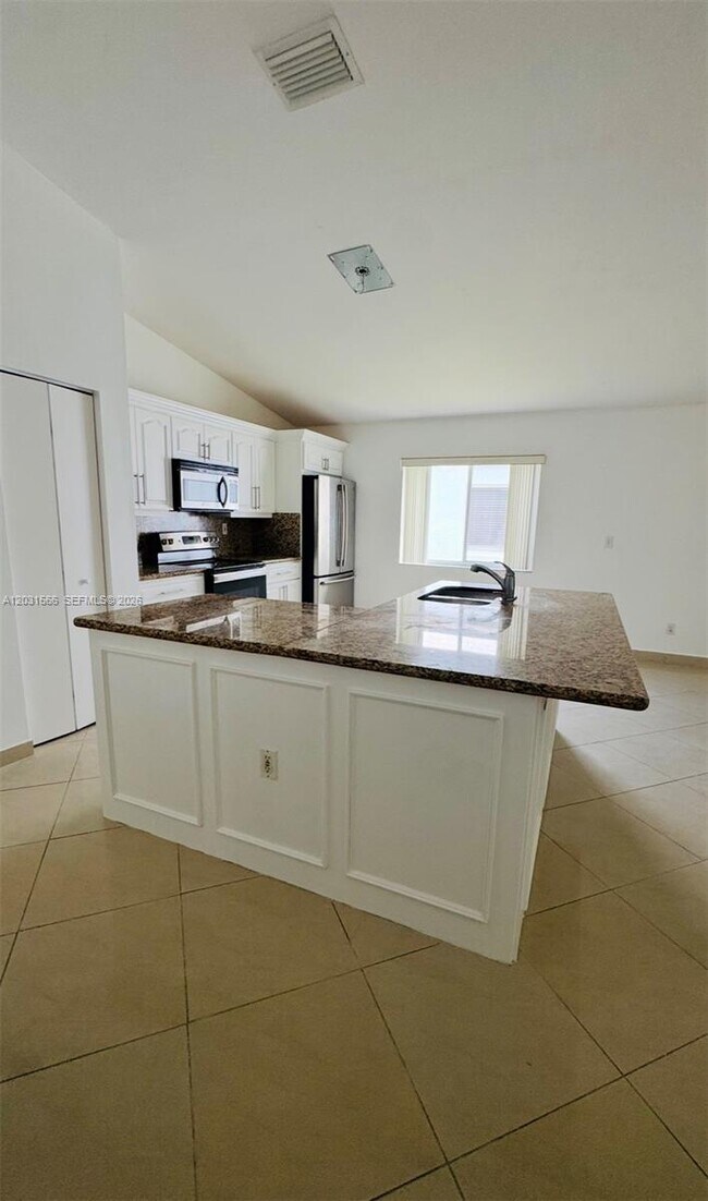 Building Photo - 10420 SW 24th Ct