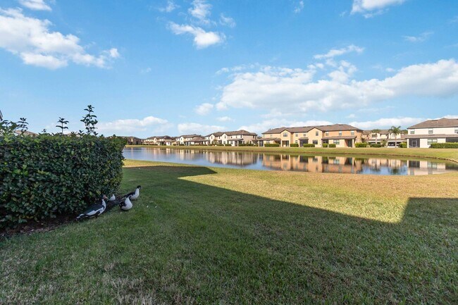 Building Photo - Bright & Stylish 3-Bedroom Townhome with Pond Views in Gated Seven Oaks