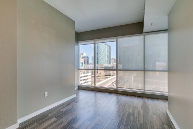 Building Photo - Iconic Strip-View Luxury | Elegant 1BR + Den High-Rise Residence