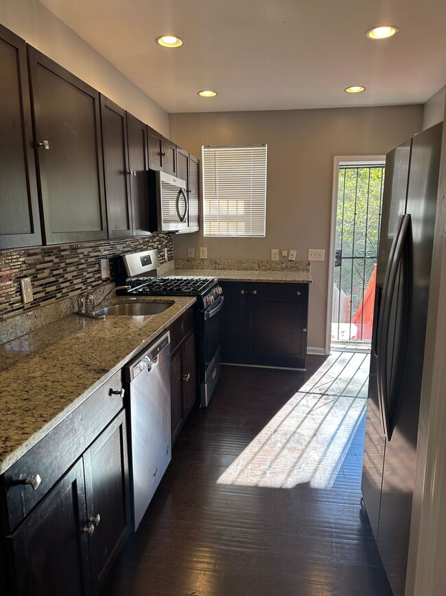 Building Photo - Beautifully Renovated Home! Master has an ...