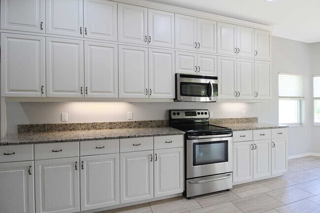 Building Photo - Annual rental: Spacious 3BR/2BA Creekwood Home with Office, Screened Lanai, EV Charger & Resort-S...