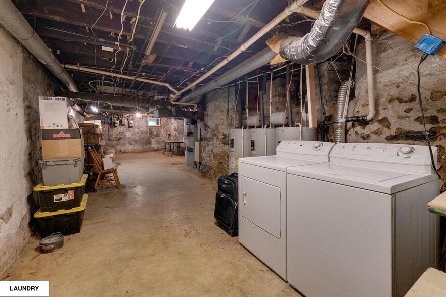 Laundry in basement. Since this picture was taken, a brand new washer/dryer was installed. - 513 1/2 W James St