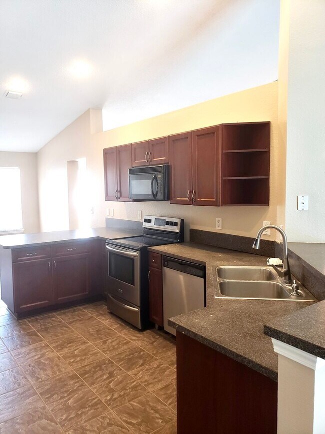 Building Photo - Beautiful home with Swimming Pool in the Hammocks. 4 bedroom 2 bath -Pool lawn service included!!!