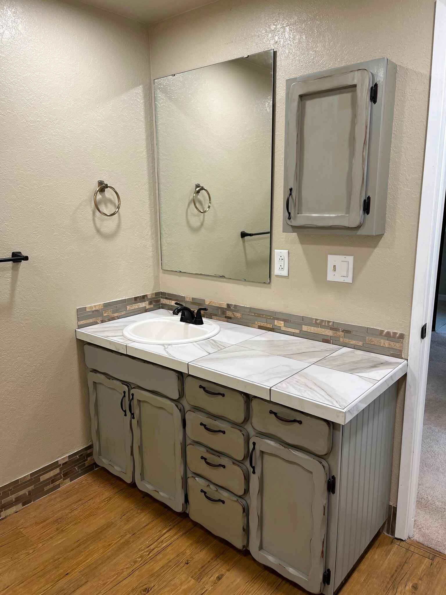 Bathroom vanity with plenty of storage and medicine cabinet and beautiful ceramic tile countertop - 21020 SE 358th St