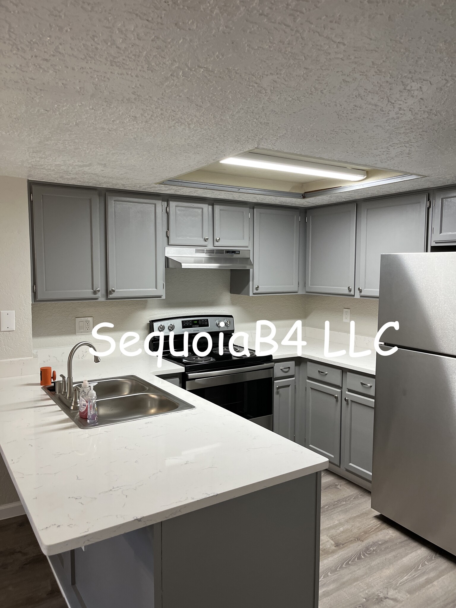 Kitchen, stainless steel appliances and quartz countertop - 6041 Sequoia Rd NW