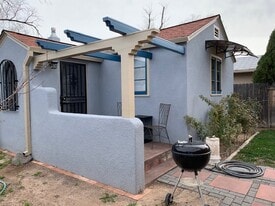 Front porch, enclosed yard, off street parking on long driveway. - 412 Carlisle Blvd NE