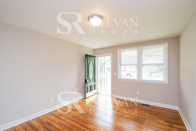 Building Photo - Welcome to this charming abode.