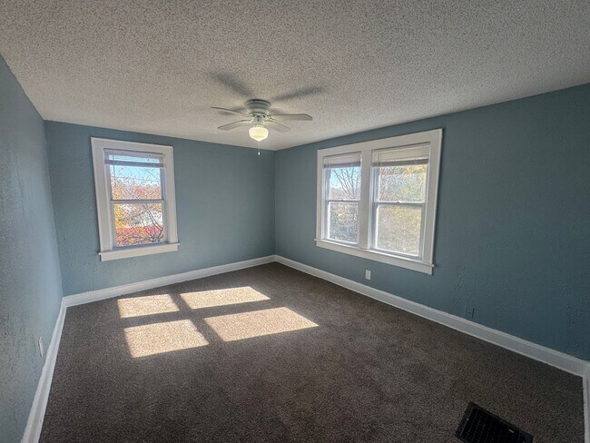 Building Photo - Charming 3BR 2BA Home w/ Fenced Yard + Covered Porch in KC