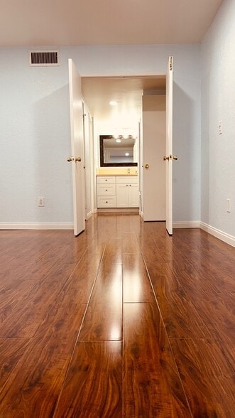 Double-door entry to a large bedroom & Bright well-lit Vanity area - 515 N Jackson St