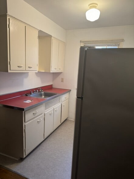 Kitchen, stove is behind the fridge. - 3097 Riddle View Ln