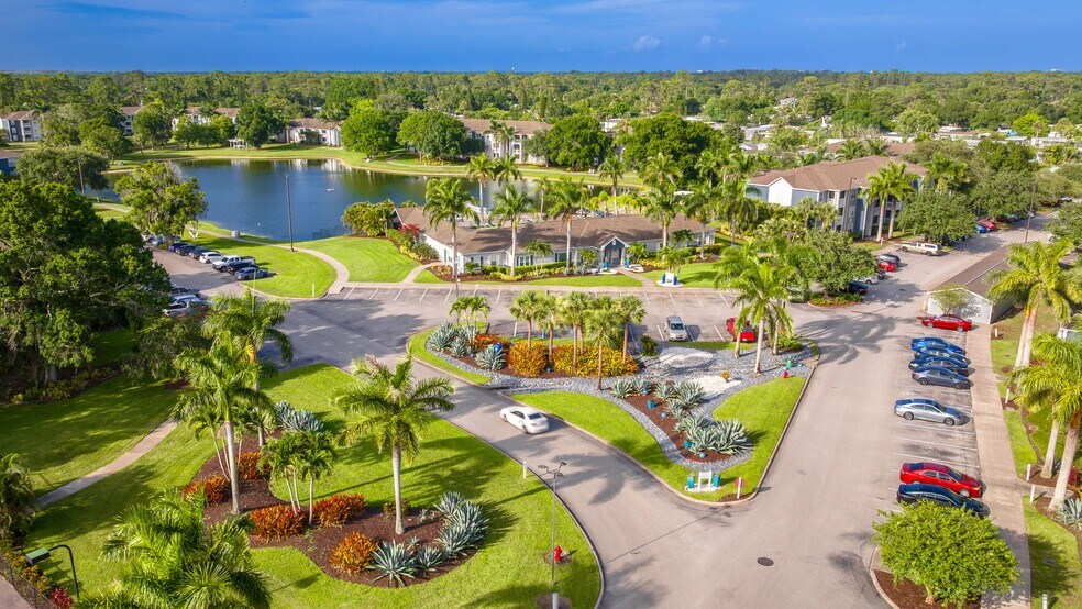 From the moment you enter, enjoy vibrant landscaping, tropical greenery, and a peaceful lakeside backdrop. - Grand Oaks At The Lake