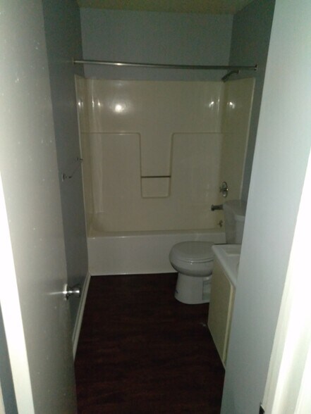 large bathroom with new toilet and marble vanity - 3009 Avenue W