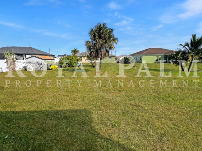 Building Photo - 3BR/2BA Home Ready to Bloom in Lehigh Acres + GARAGE!!