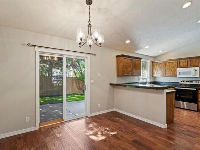 Building Photo - June Rent Free!!  Move Today!  Four Bedroom, Three Bath Home with Beautiful Backyard, Two Car Gar...