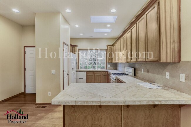 Building Photo - Serene 4-Bed Home with Huge Common Room & Deck!