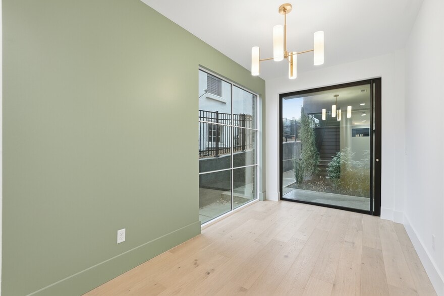 Welcoming entry way with staircase and oversized windows - 3718 West End Ave