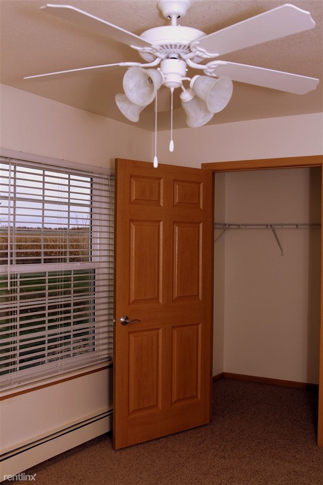 Walk-in closet. Ceiling fan in main bedroom. - Cherry Hill Manor Apartments