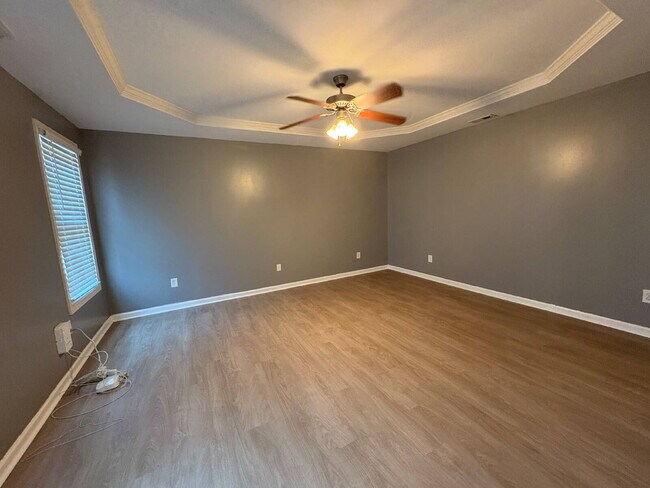 Building Photo - Spacious 4-Bedroom Sanctuary with Cozy Fireplace on Chimney Swift Drive!
