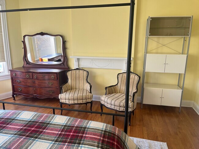 Dresser and bookcase in bedroom - 2712 Saint Paul St