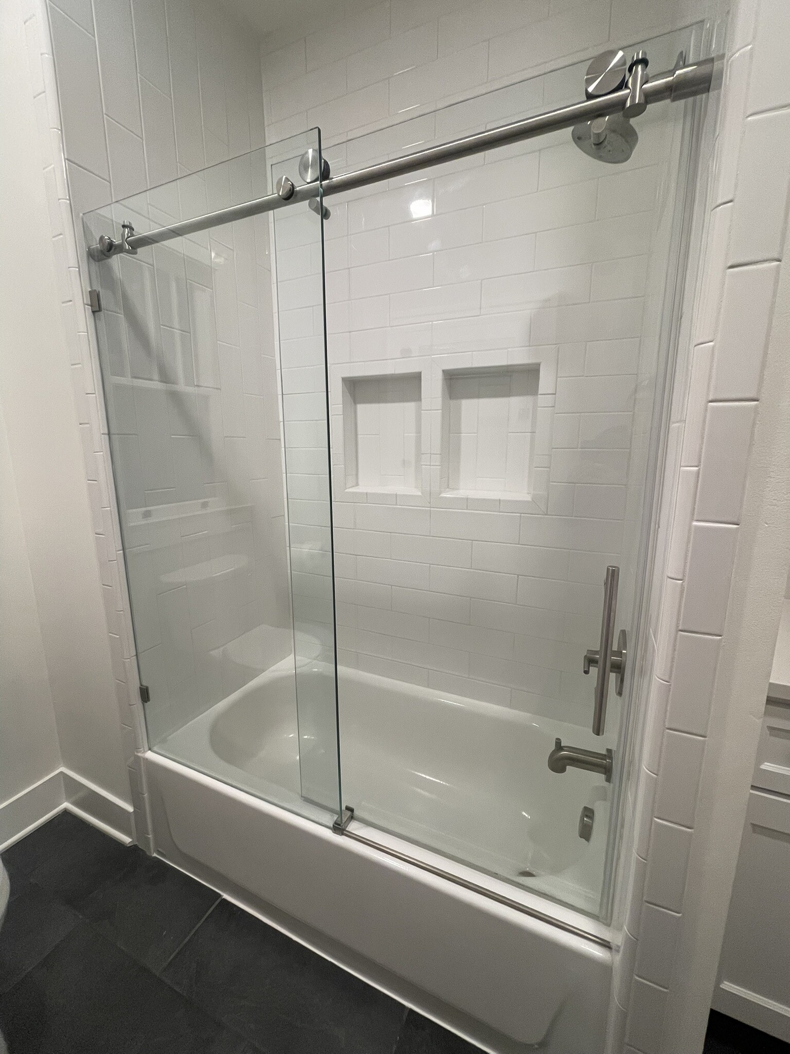 Modern sliding glass shower doors and tile tub surround - 508 Daly Ave