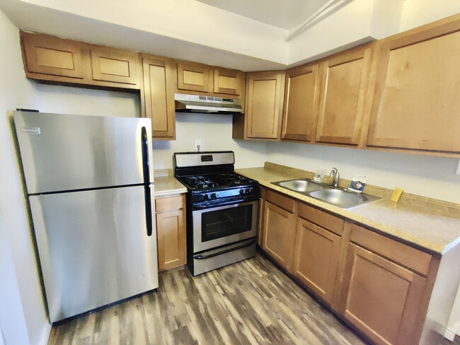 Experience the harmony of style and function in this sleek kitchen design. - Barnum Park