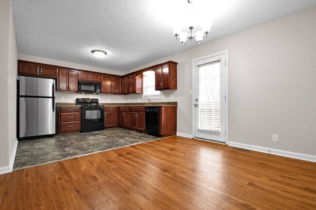 Building Photo - Pet Friendly Three Bedroom with Bonus!