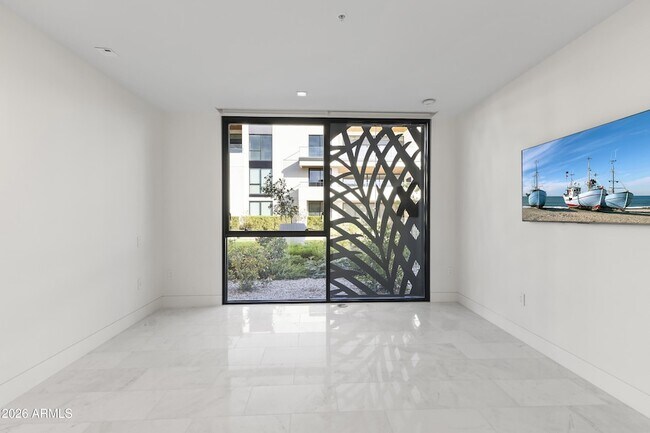 Building Photo - 6587 N Palmeraie Blvd