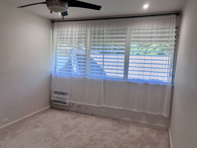 Building Photo - Available Now | 2 Bedroom, 2 Bathroom Townhouse with 1 Assigned Parking Stall at Tropic Gardens 1