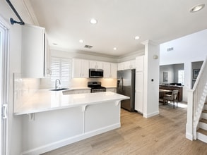 Building Photo - Join the Waitlist and Coming Soon......Imagine opening the door to a home that immediately welcom...