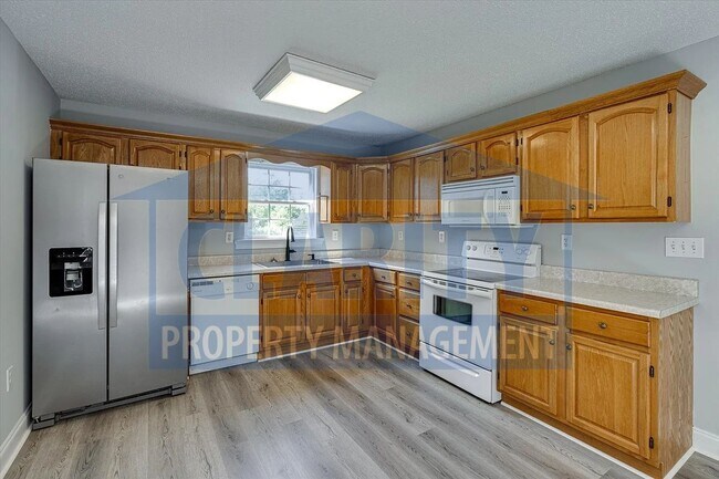 Building Photo - Updated house with carport and shed on corner lot!