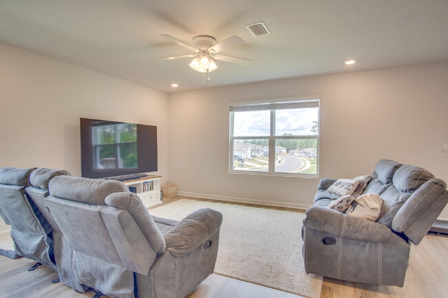 Building Photo - Spacious 4BR Home with 2-Car Garage Near M...