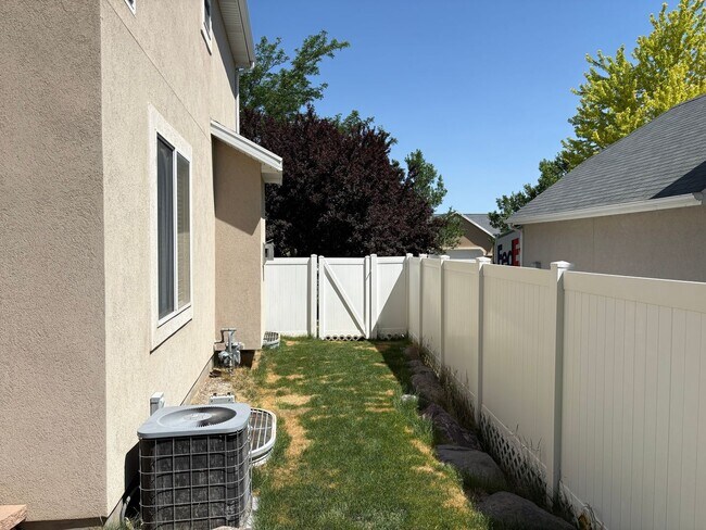 Building Photo - OPEN HOUSE | Spacious Herriman Home Featuring a Large, Well-Maintained Fenced Backyard and Basement