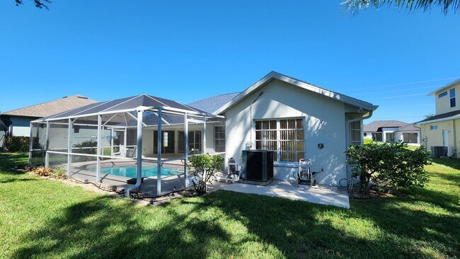 Building Photo - Fresh Paint, New Floors, and a Heated Pool...