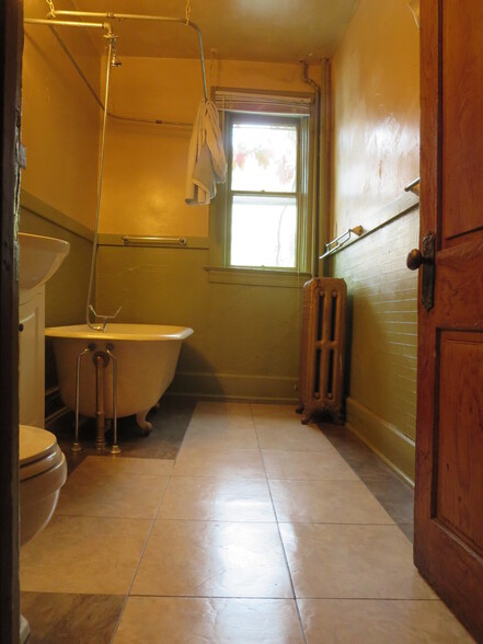 Bathroom with clawfoot tub. - 204 S 6th St
