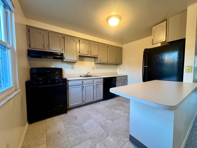 Primary Photo - Must-See Two Bedroom Townhouse in Plum! Up...