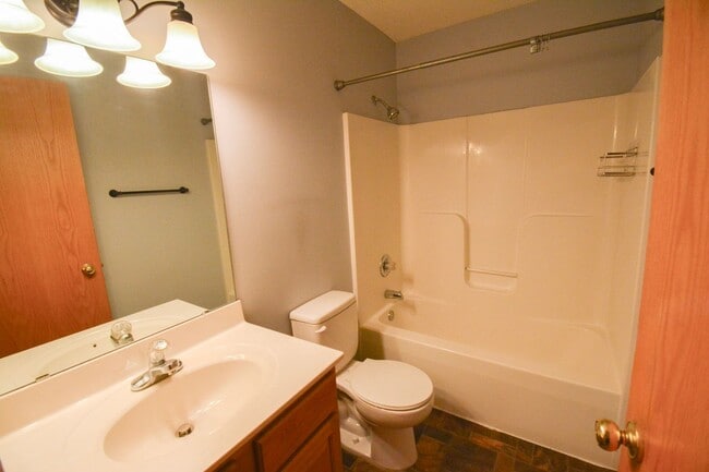 Building Photo - Spacious 2-story townhouse with extra garage space available!