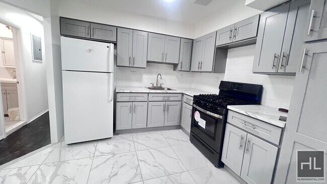 Building Photo - GUT RENOVATED VERY LARGE 3 BEDEROOMS W/ PR...