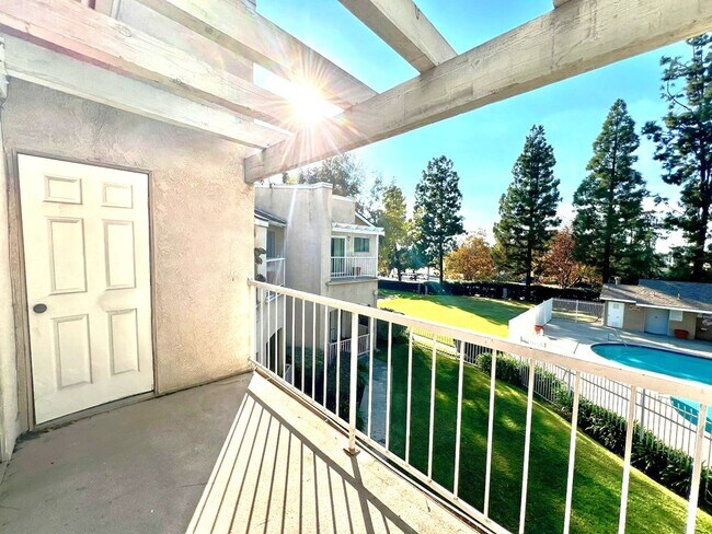 Building Photo - 2 Bedroom, 2 Bath Upstairs Condo with Private Balcony & 2-Car Garage, Gated Community, Water/Tras...